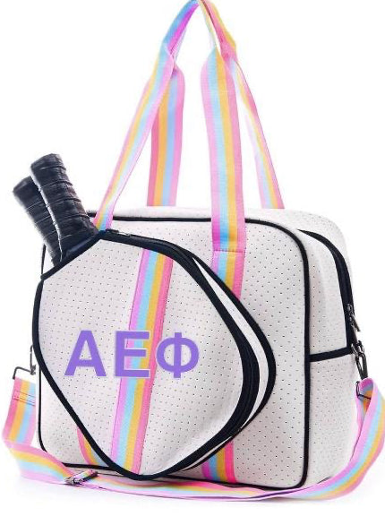 White bag with colorful straps and 'AEPhi' letters on a white background